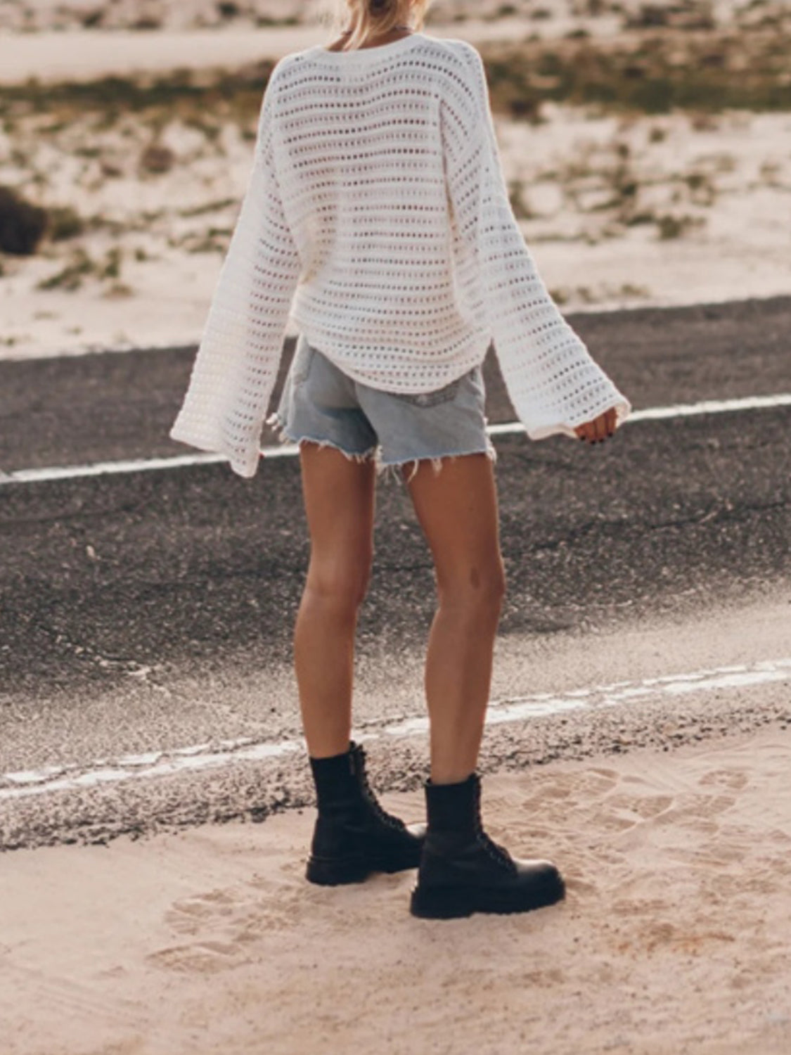 BELLA openwork round neck dropped shoulder knit top featuring a stylish, breathable design with a relaxed fit.
