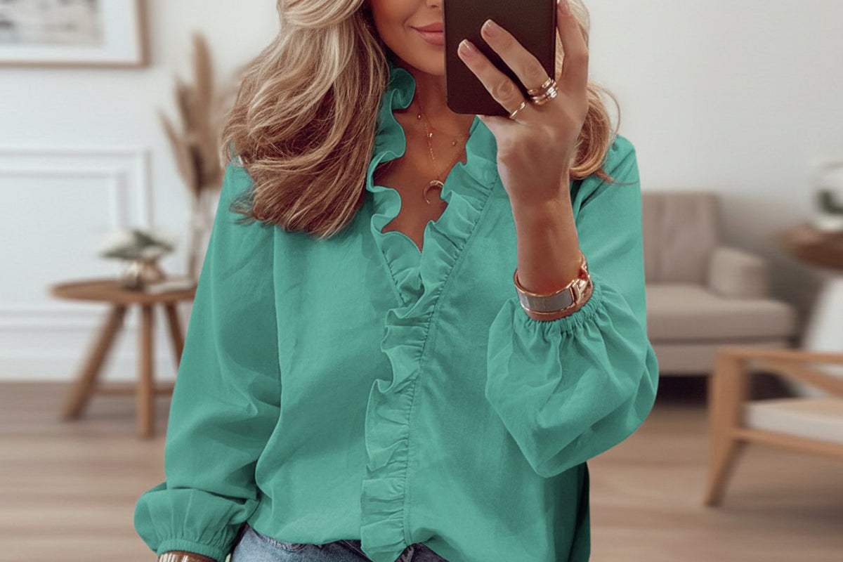 Full size BELLA BLA ruffled V-neck long sleeve blouse with a feminine design, featuring ruffles and a V-neck style.