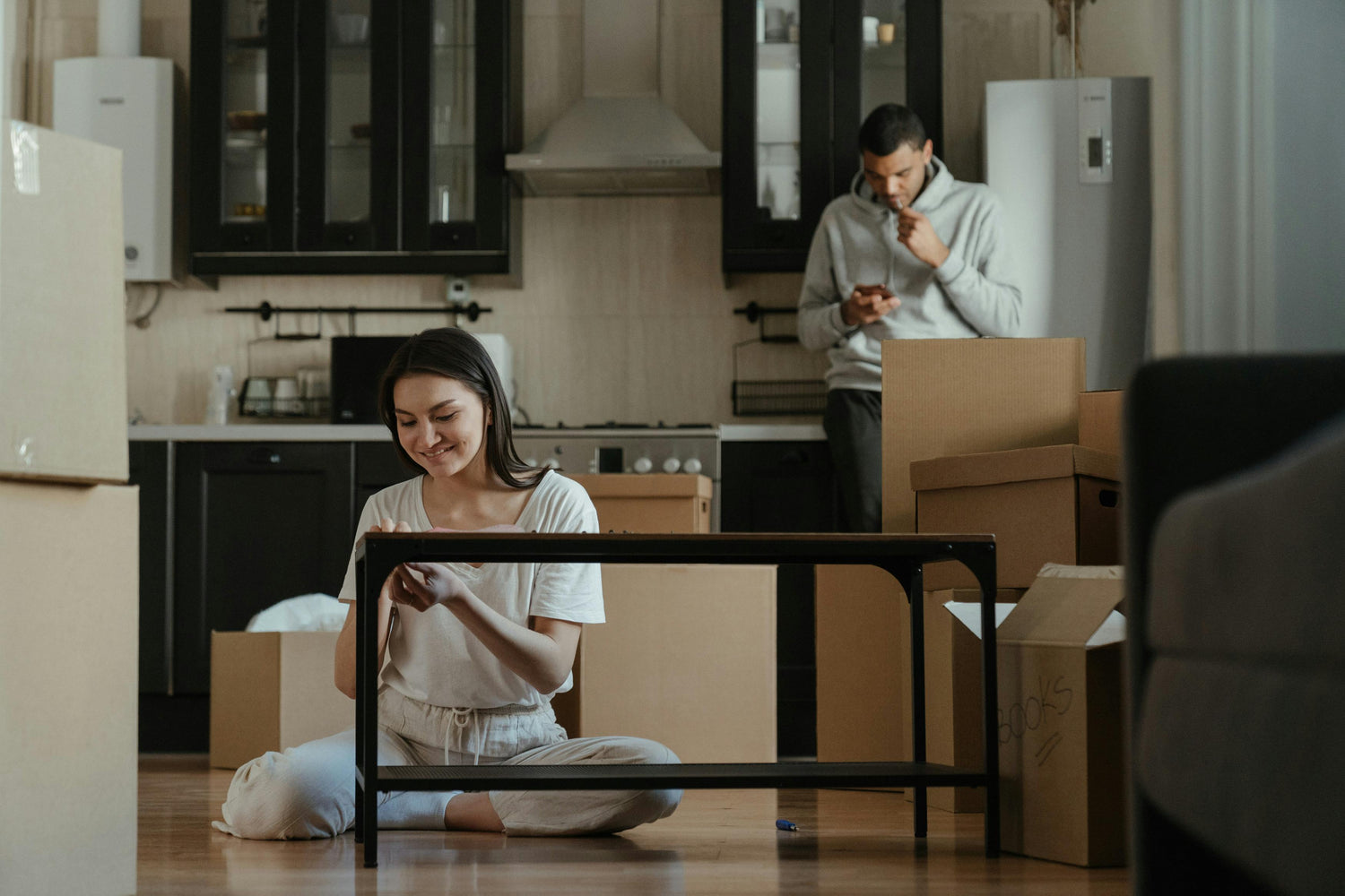 girl and boy putting together furniture