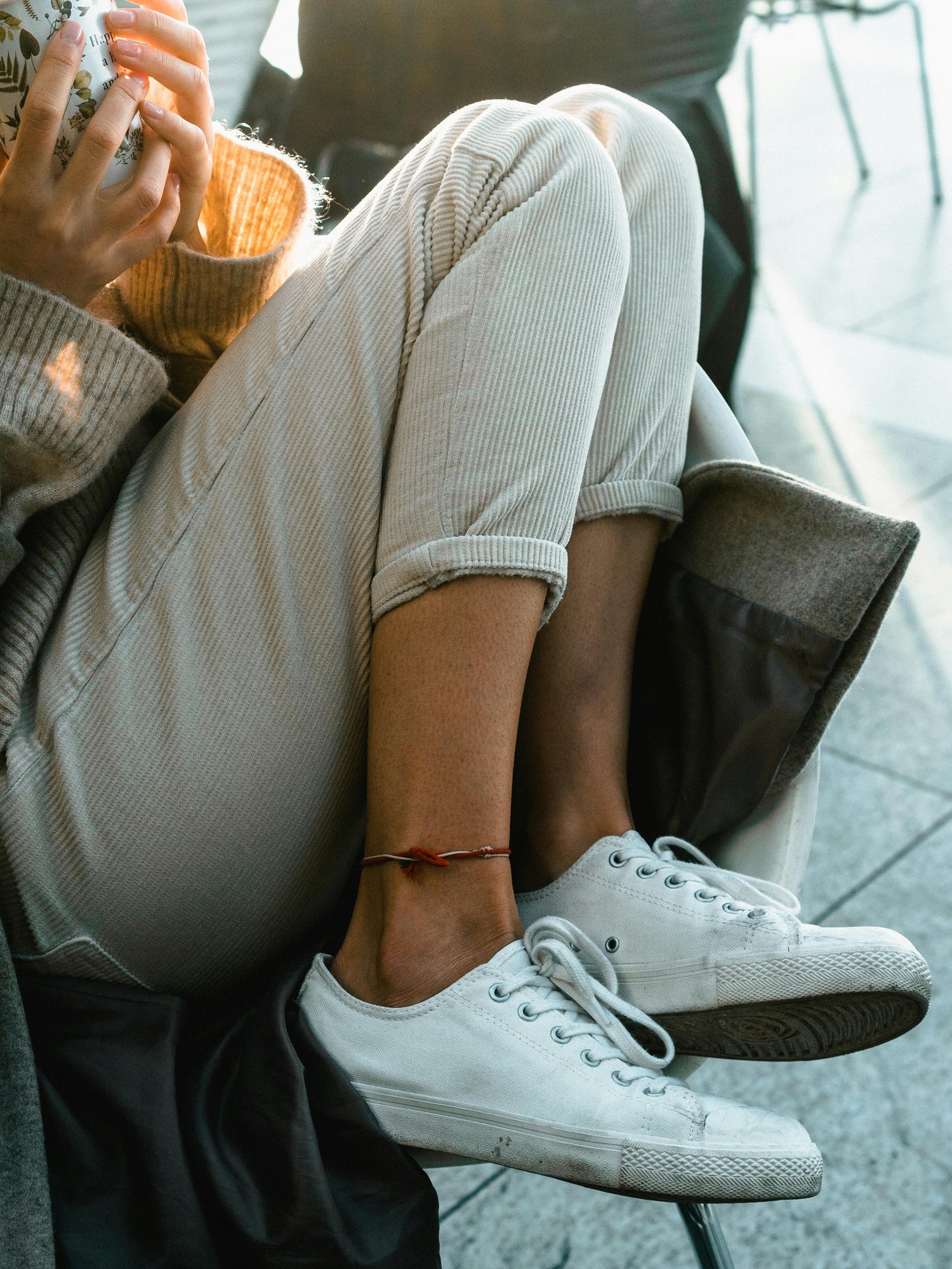 girl sitting with pants on