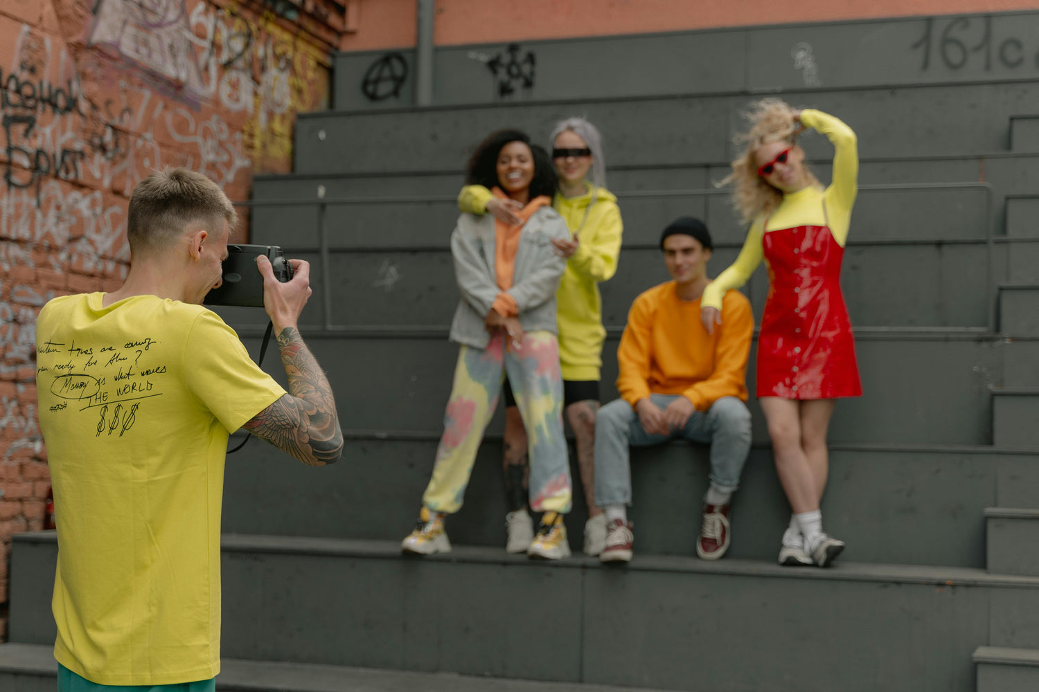 girls and boy models taking a photo together 