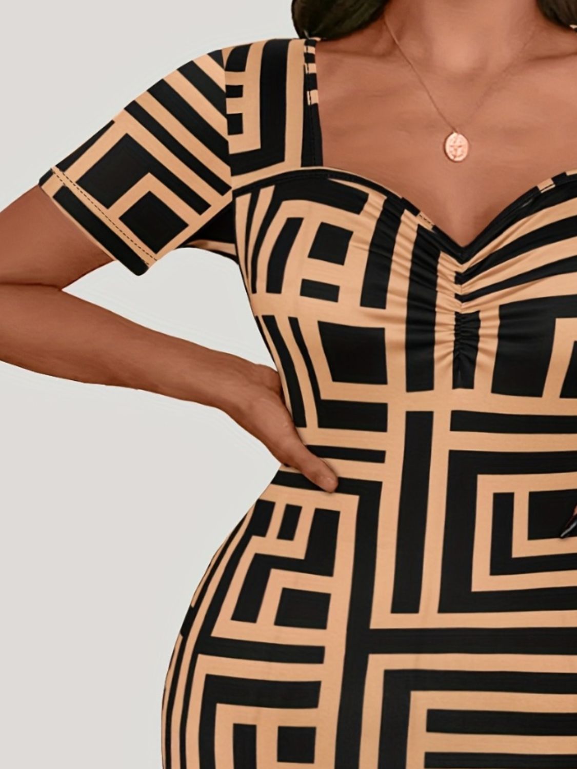 Plus size BELLA sweetheart neck short sleeve mini dress with a fitted bodice and flared skirt, perfect for casual or dressy occasions.