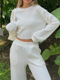 BELLA Waffle-Knit Round Neck Top and Pants Set in cozy textured fabric, perfect for casual wear.