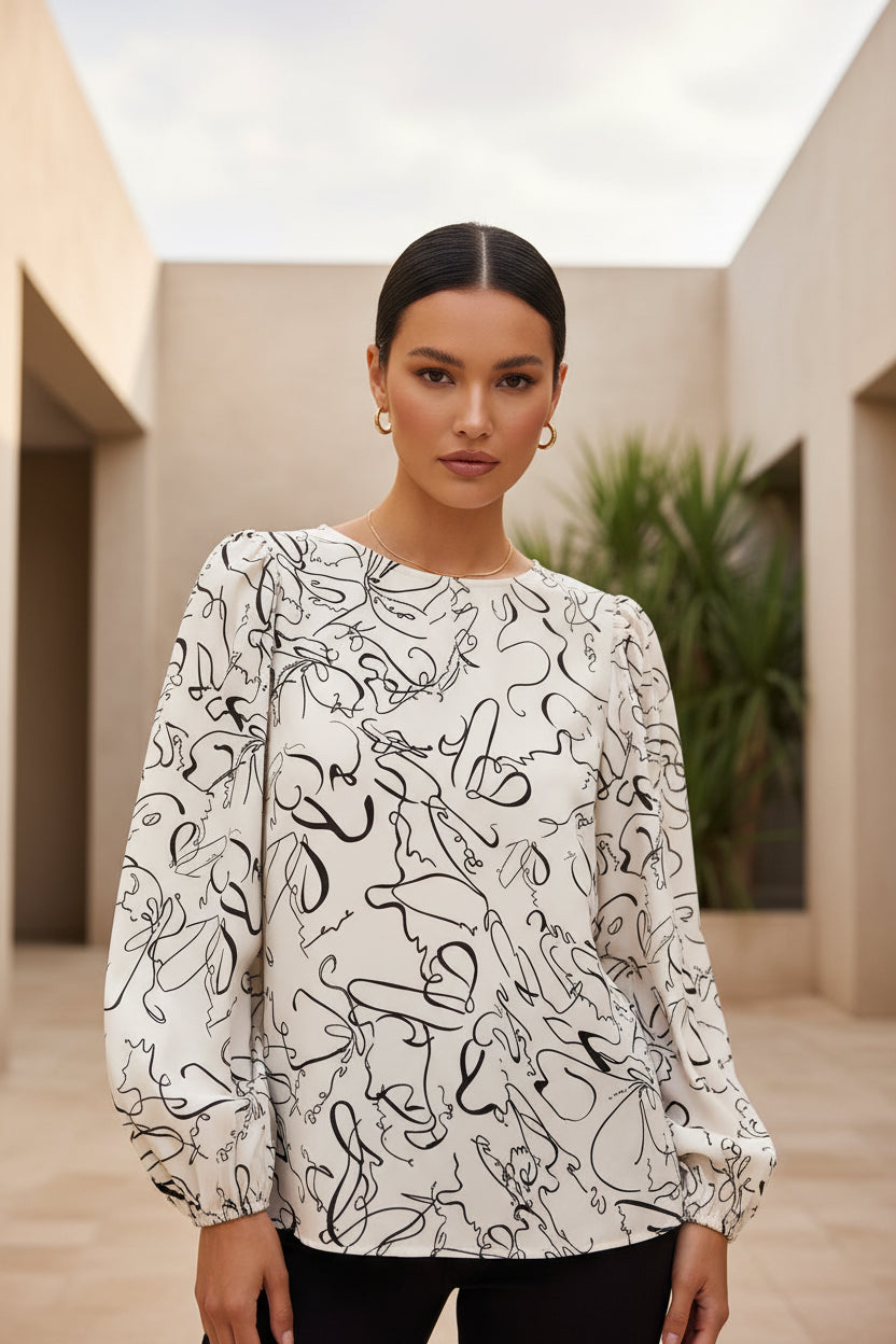 Printed round neck blouse with three-quarter sleeves from BELLA BLA, featuring stylish pattern and comfortable fit.