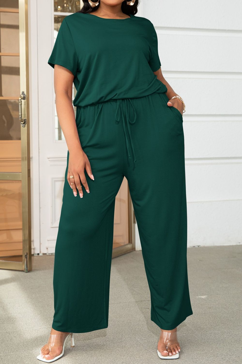 Plus size BELLA drawstring waist short sleeve jumpsuit, casual romper with a relaxed fit and comfortable design.