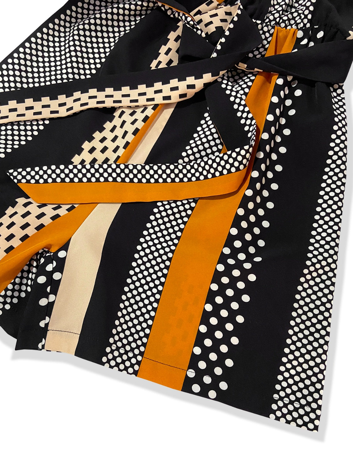 BELLA Tied Color Block Sleeveless Romper featuring bold color blocking and a stylish tied waist detail.