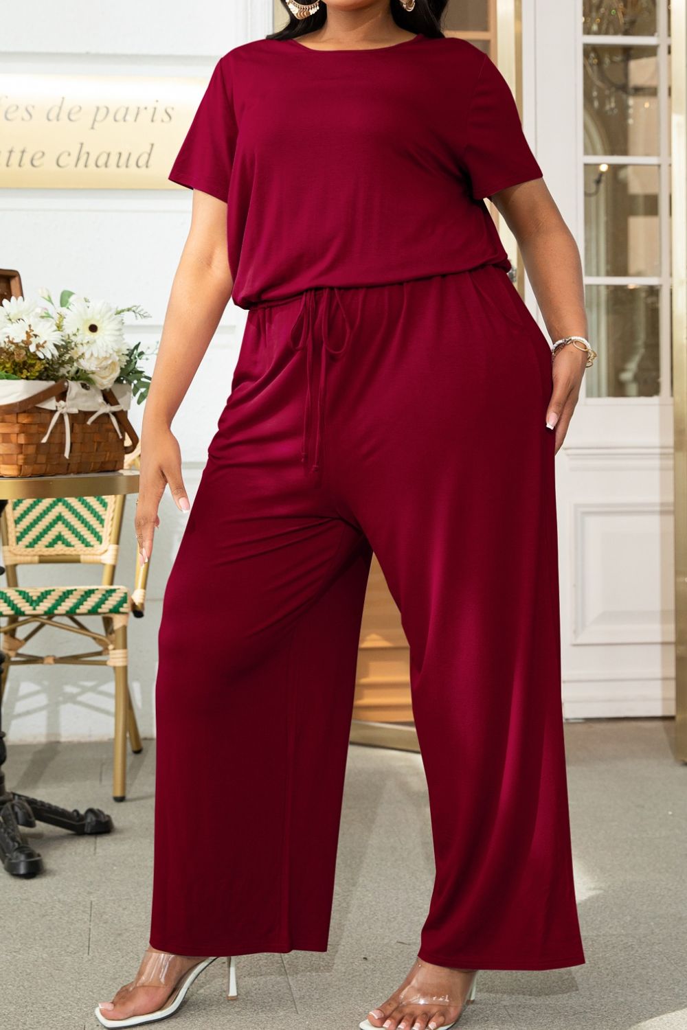 Plus size BELLA drawstring waist short sleeve jumpsuit with casual fit, ideal for comfortable, trendy summer wear.