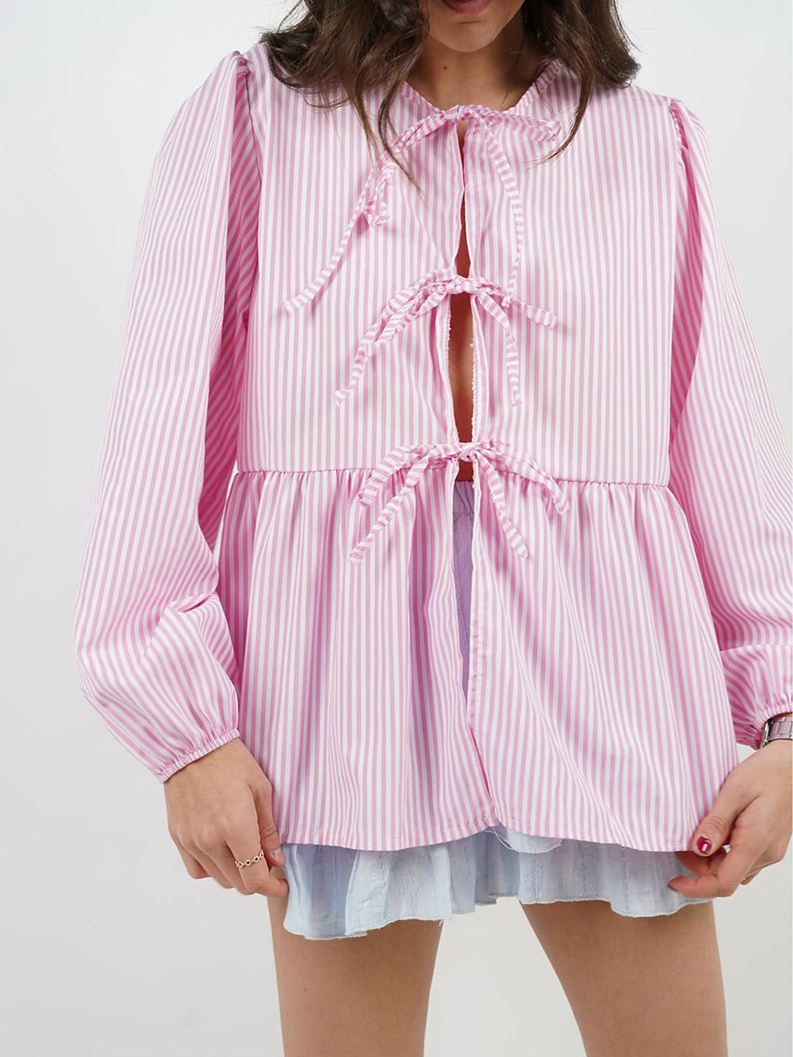 BELLA BLA tied round neck long sleeve blouse from trendsi, featuring a stylish design with a tied neckline and long sleeves.