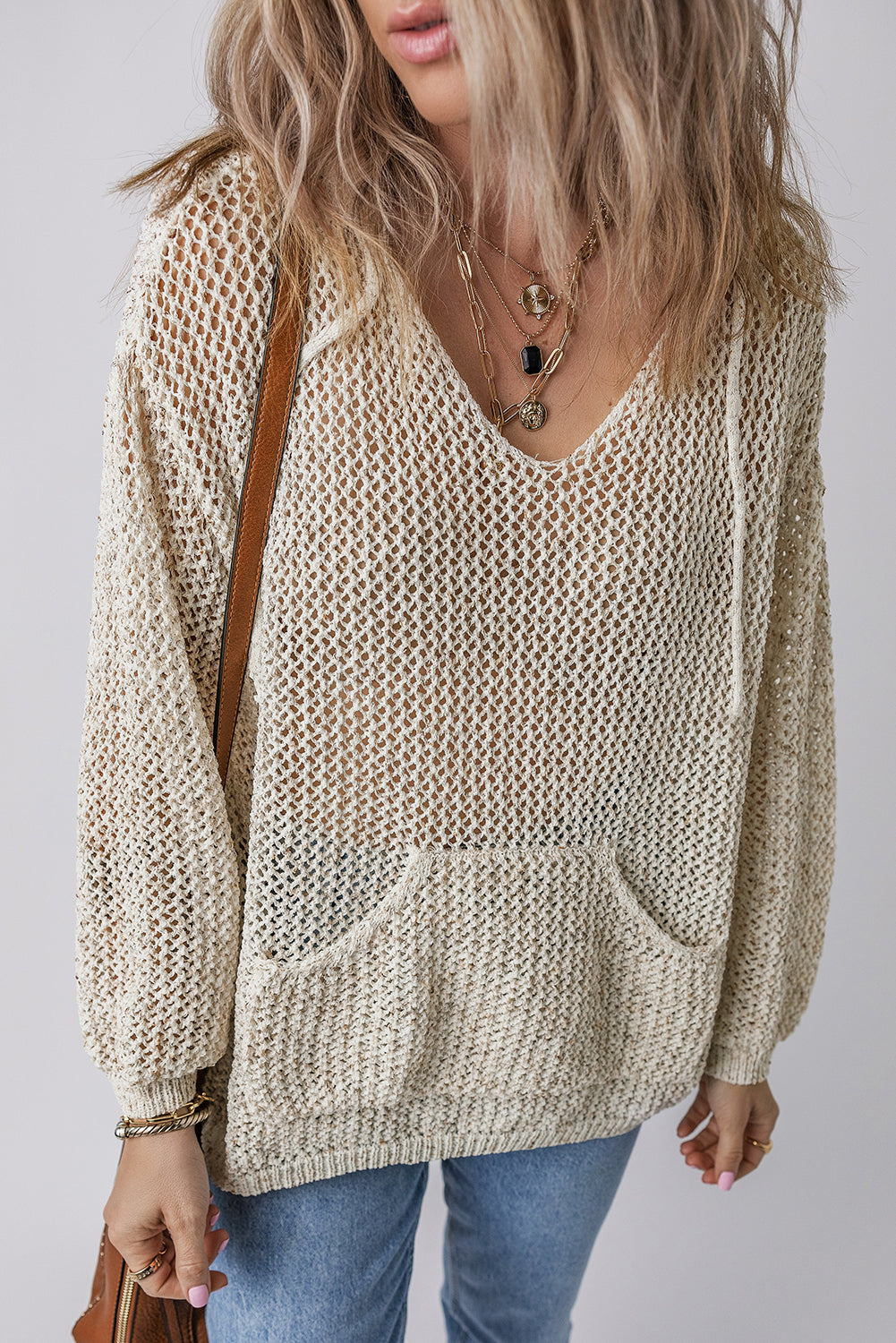 BELLA openwork dropped shoulder hooded knit top featuring a stylish, breathable design with a relaxed fit and trendy open-knit pattern.