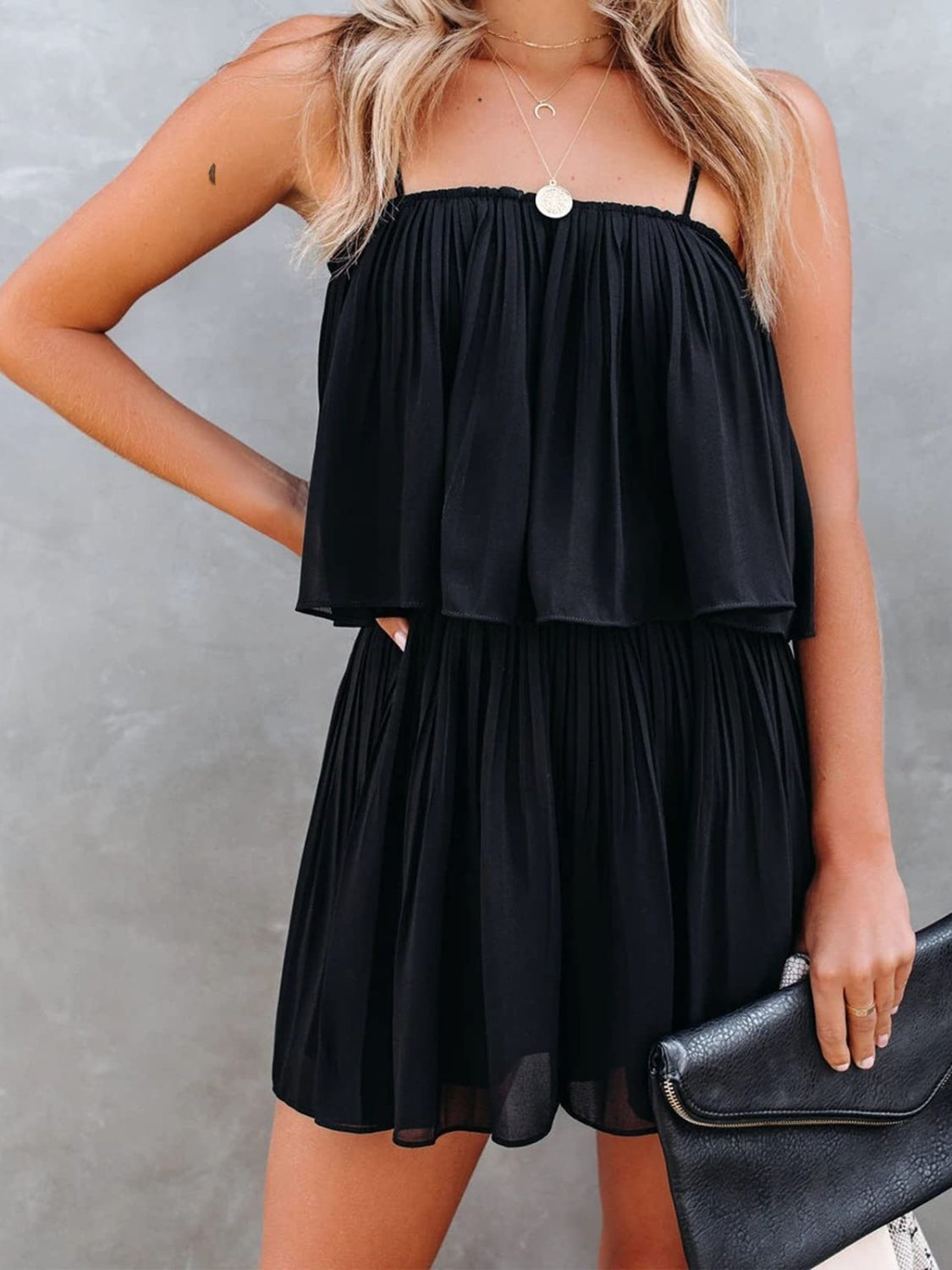 BELLA trendsi ruched spaghetti strap romper displayed on a model, featuring a fitted design with adjustable straps and stylish ruching.