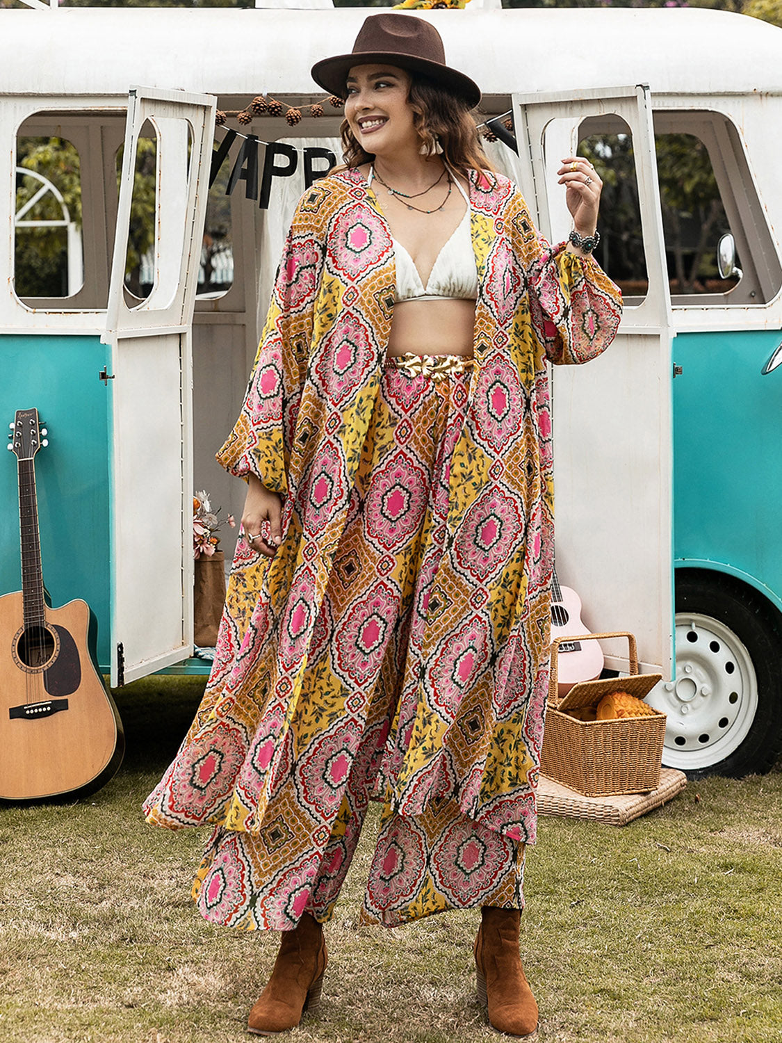 Plus size printed open front cover-up and pants set by BELLA, featuring a colorful floral pattern and relaxed fit.