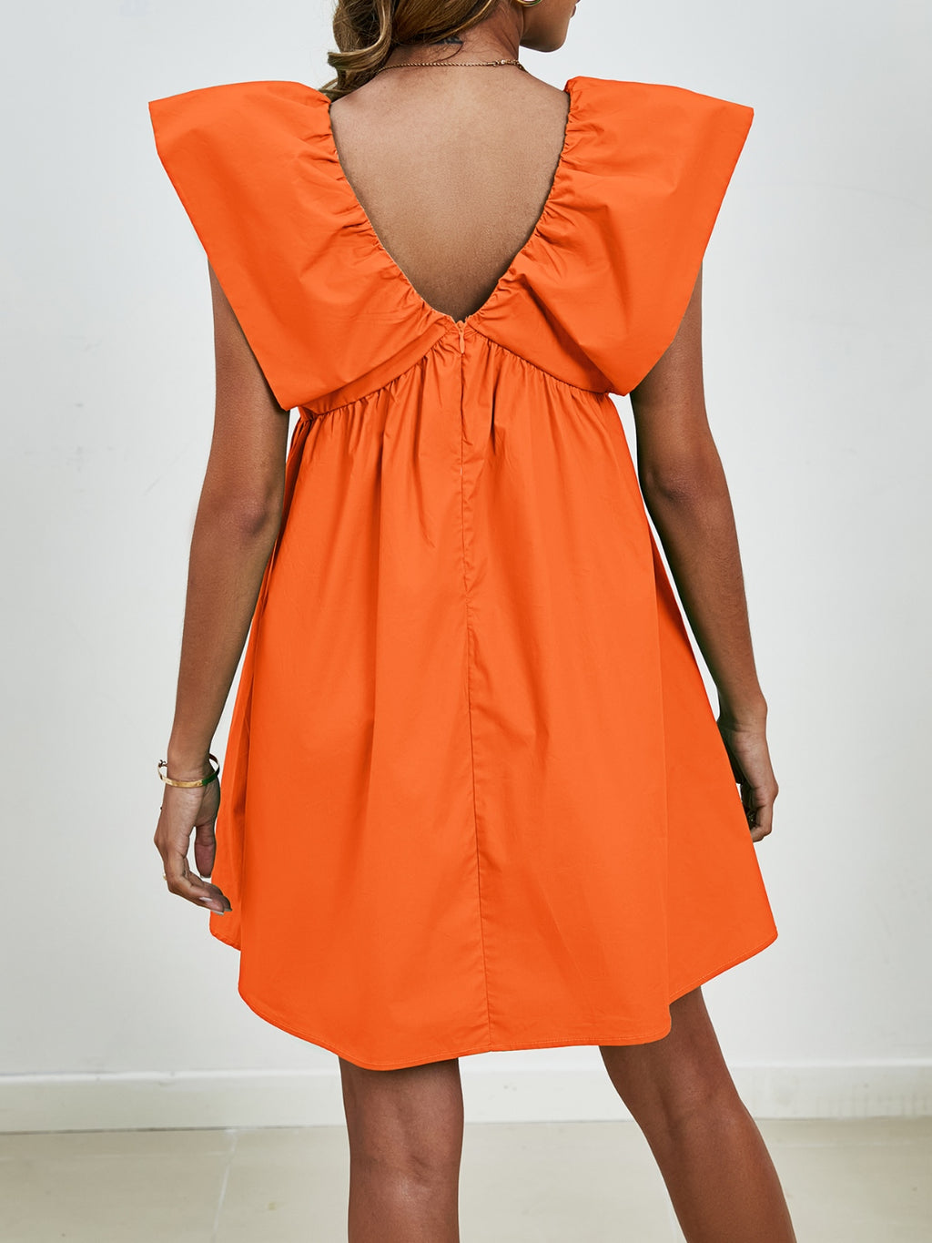 BELLA V-neck cap sleeve mini dress from Trendsi, featuring a stylish V-neckline and a fitted cap sleeve design.