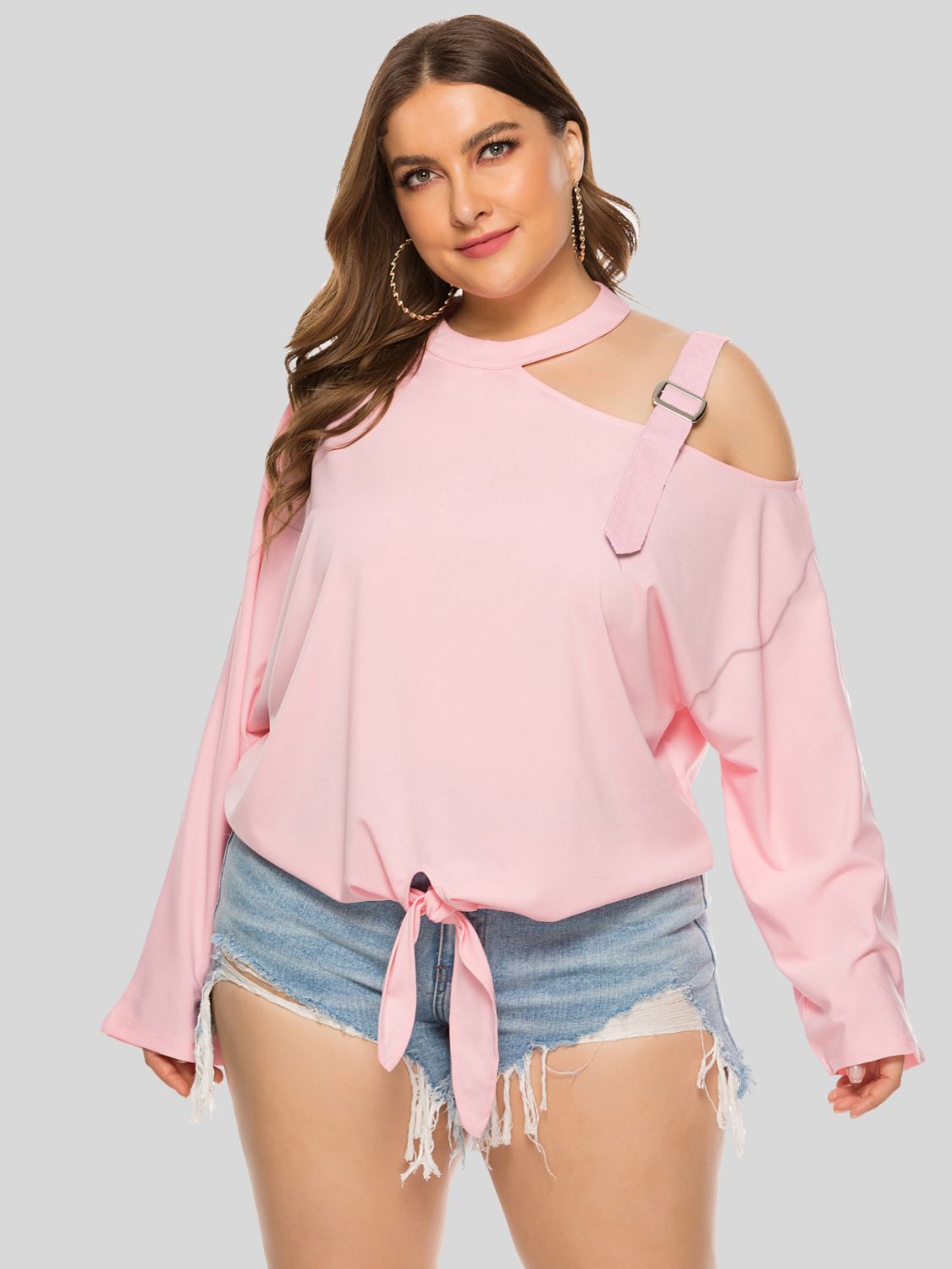 Plus size cold-shoulder tied top from BELLA, featuring trendy design with cut-out shoulders and a stylish tie detail.
