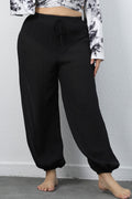 Plus size BELLA drawstring jogger pants with elastic waistband and relaxed fit, shown in a casual, comfortable style.
