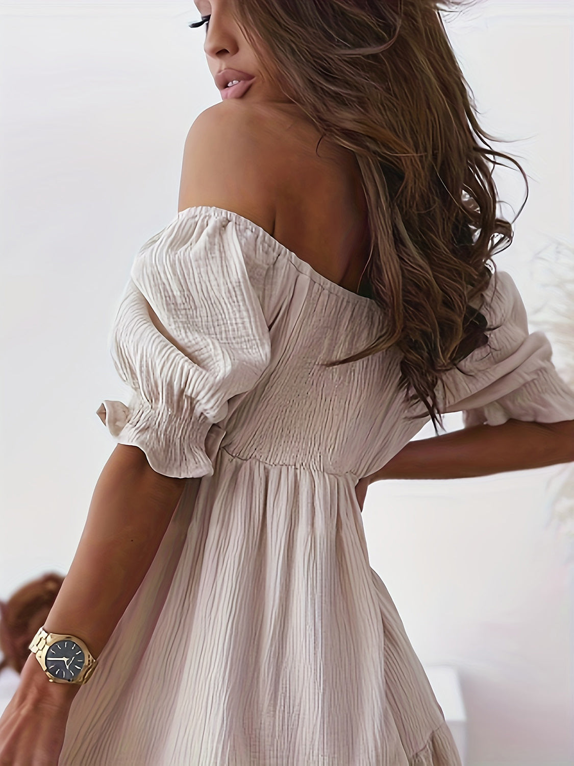 BELLA trendsi full size ruffled off-shoulder short sleeve dress displayed on a hanger, showcasing its feminine design and ruffle details.