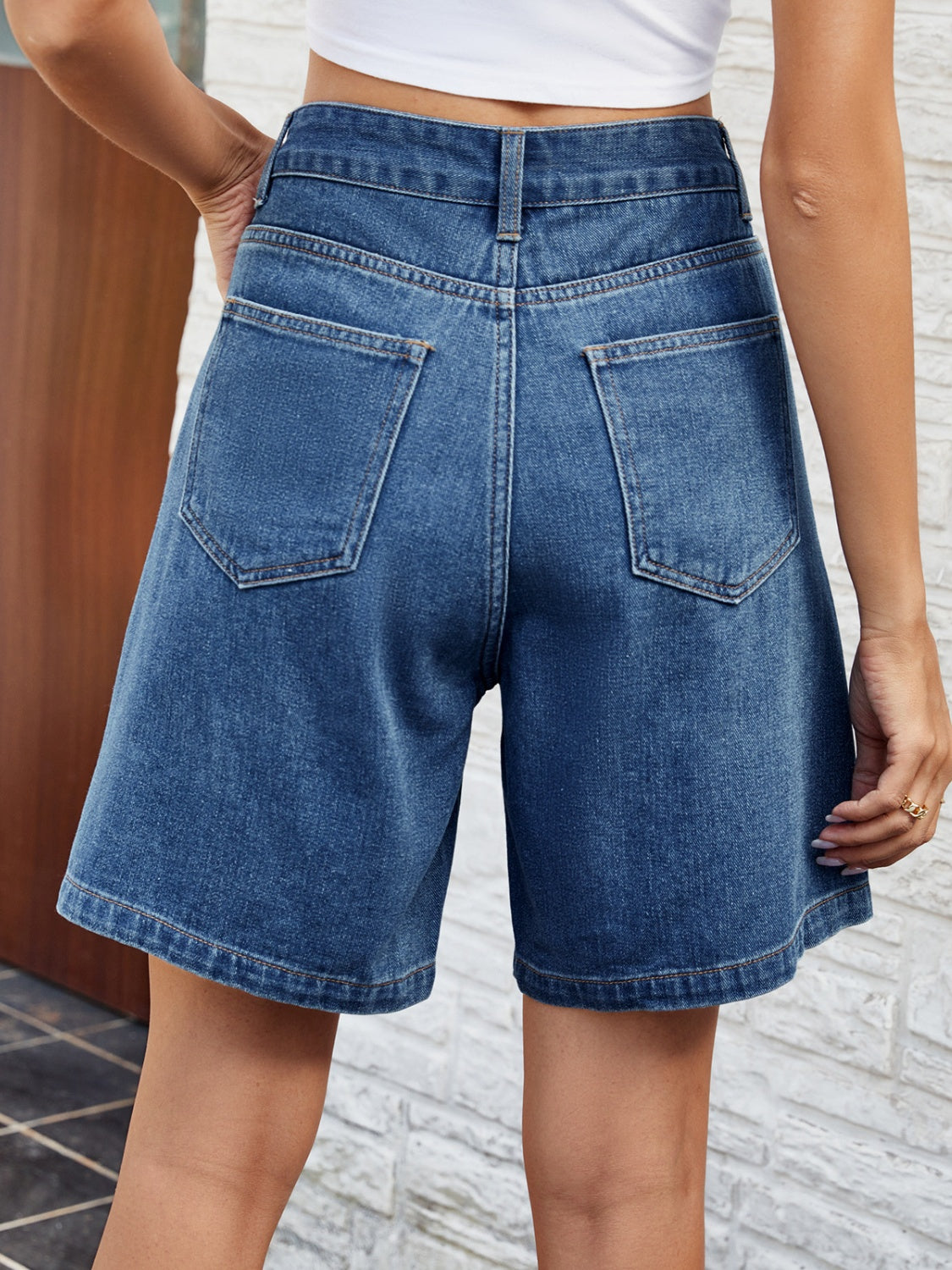 BELLA high waist denim shorts with front and back pockets, featuring a trendy fit and classic blue denim wash.