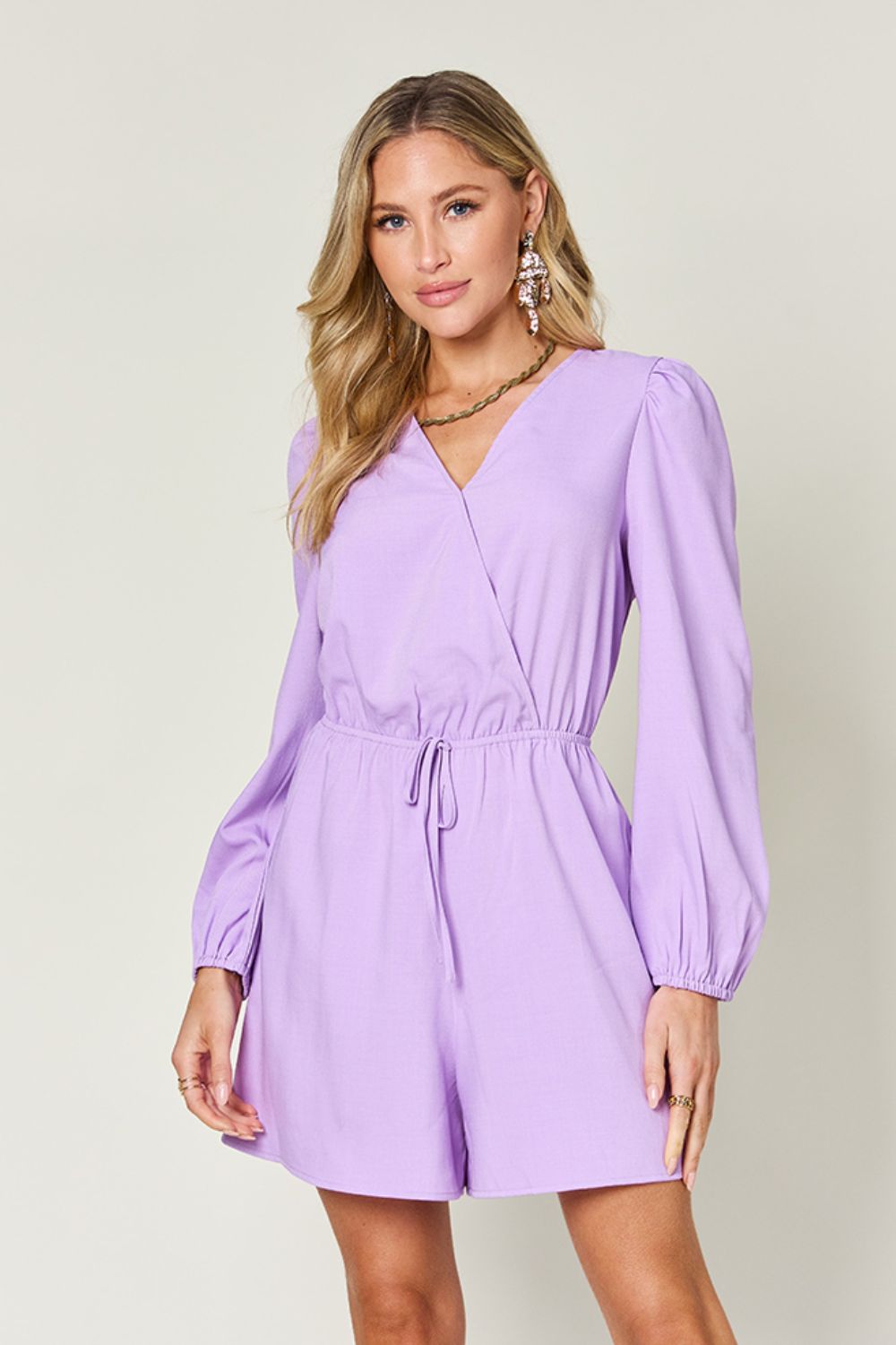 BELLA Double Take full size long sleeve romper with drawstring waist, casual trendy style, worn by a model.