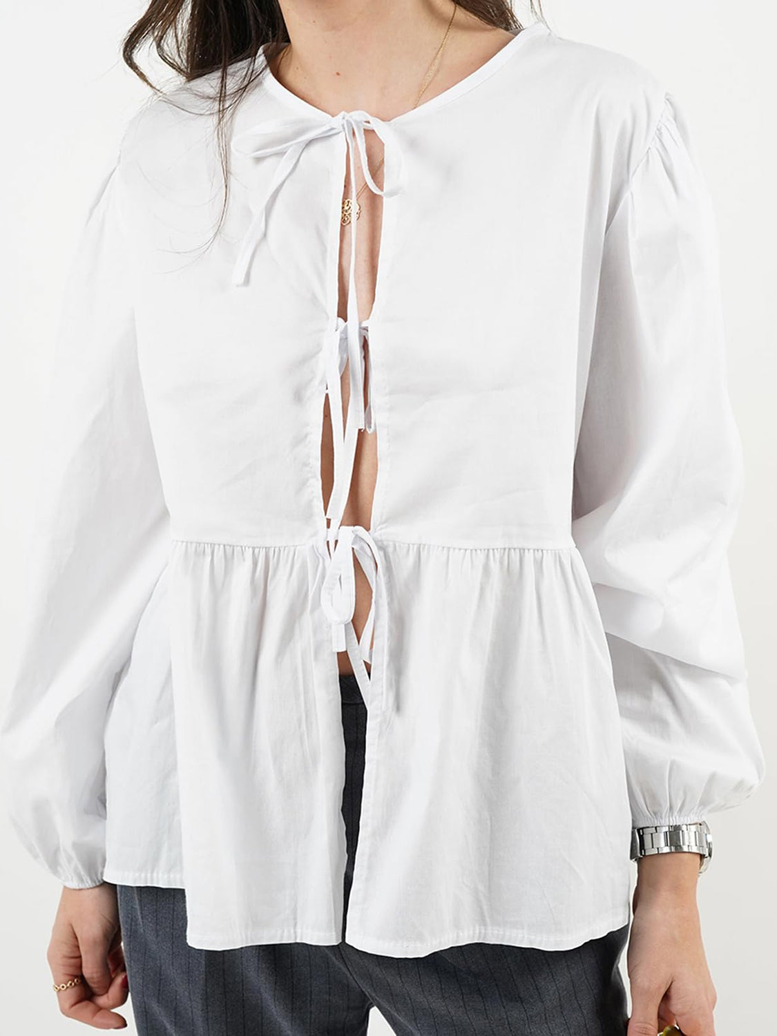 BELLA BLA Tied Round Neck Long Sleeve Blouse in trendy fabric, featuring a relaxed fit and stylish design, shown on a model.