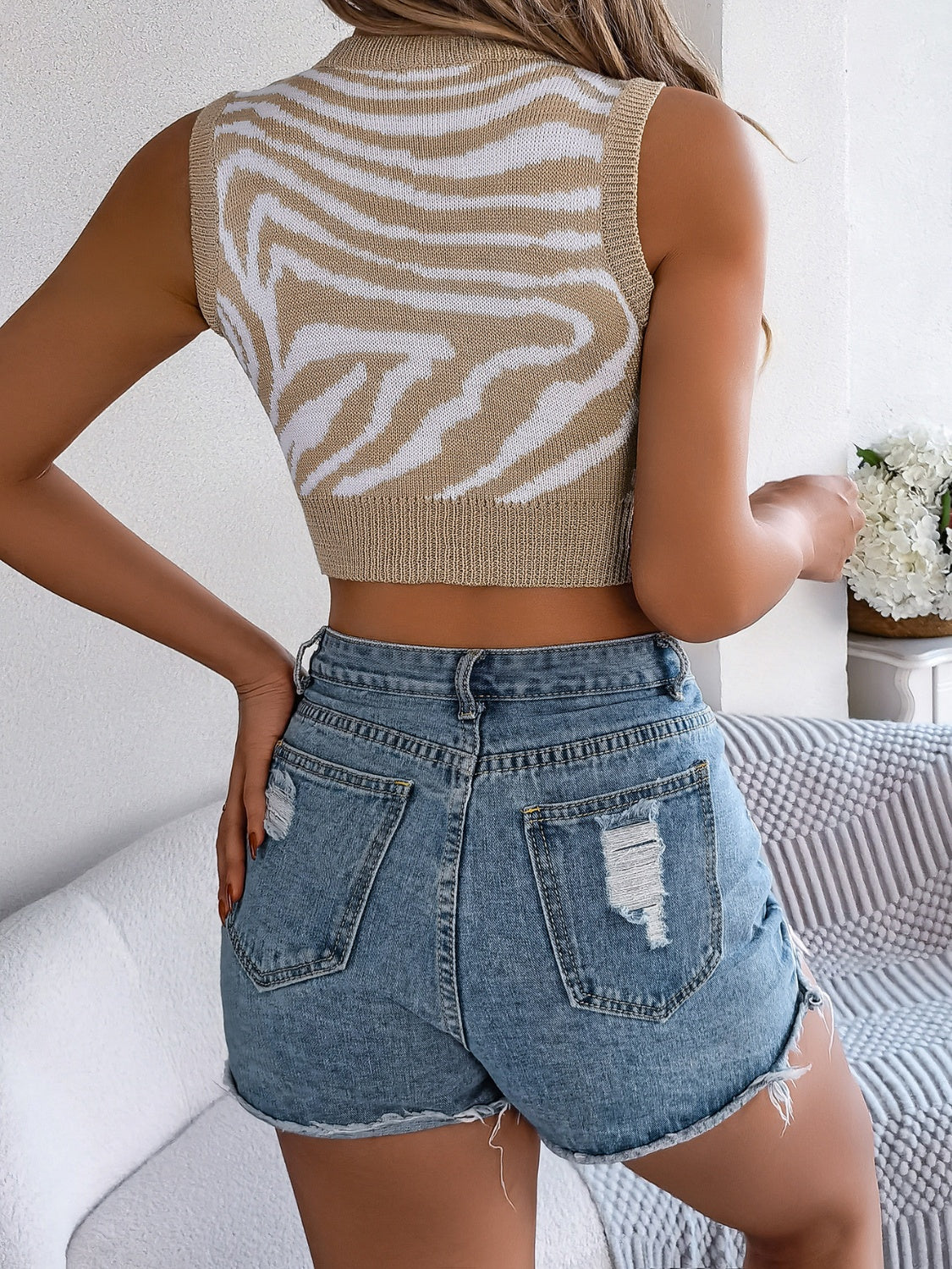 BELLA BLA trendsi cutout animal print round neck tank top, featuring a stylish pattern and sleeveless design.