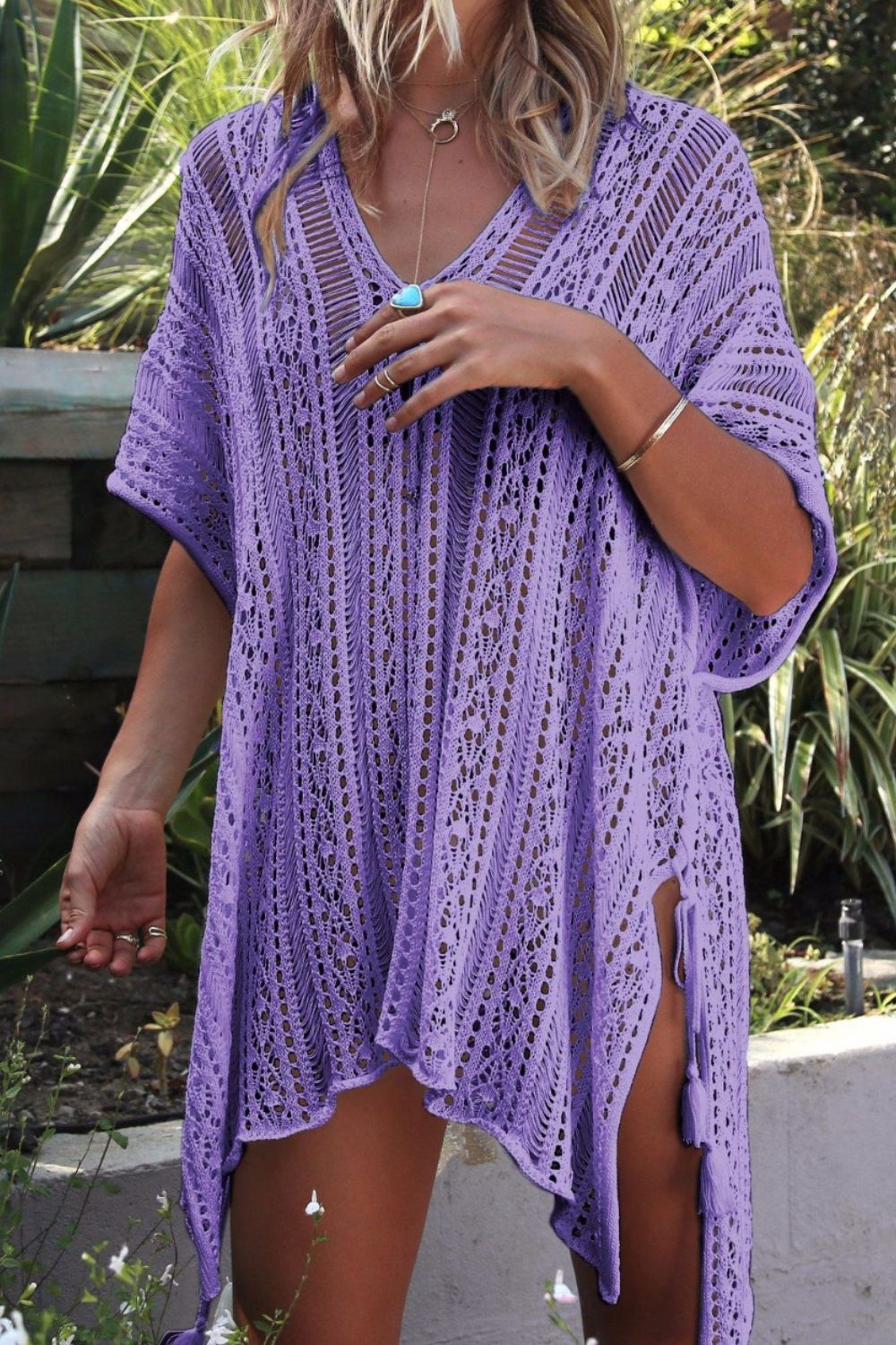 BELLA Trendsi cutout V-neck cover-up with tassels, lightweight beachwear featuring stylish cutout design and decorative tassels.
