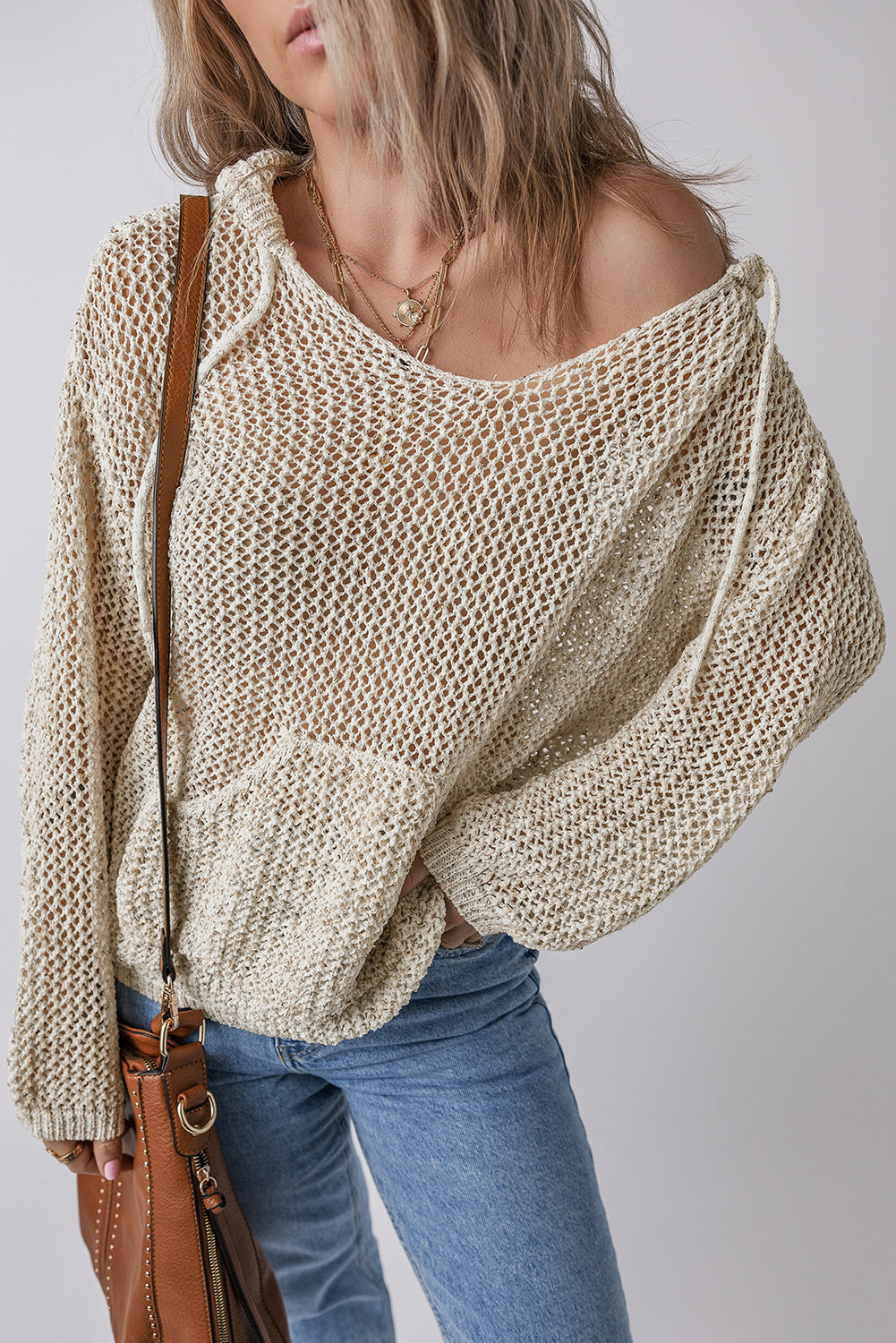Bella Trendsi openwork dropped shoulder hooded knit top with relaxed fit and stylish design, shown in natural fabric detail.