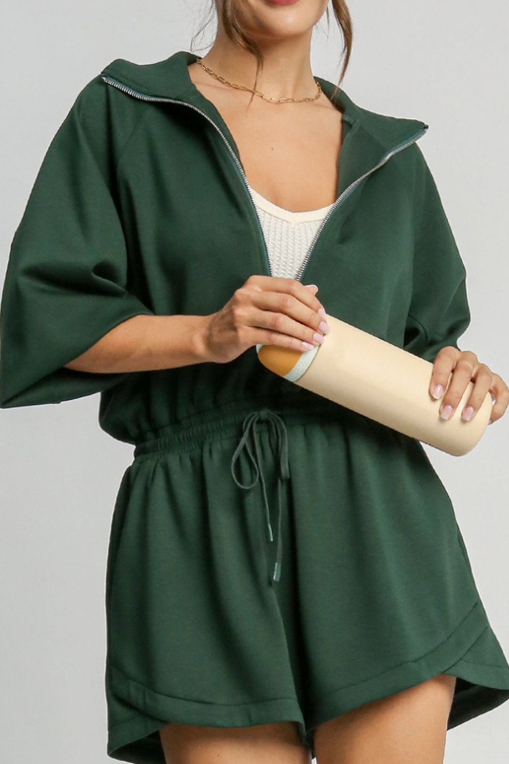 BELLA trendsi drawstring half zip long sleeve romper displayed on a model, featuring a casual fit and stylish design.