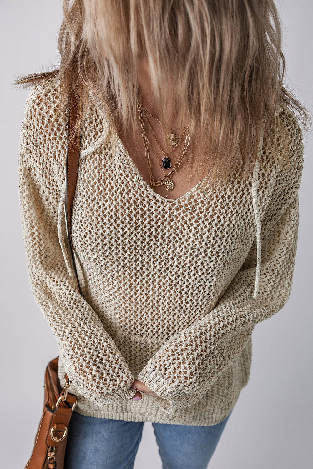 Openwork dropped shoulder hooded knit top by BELLA, featuring a stylish openwork design and relaxed fit with dropped shoulders.