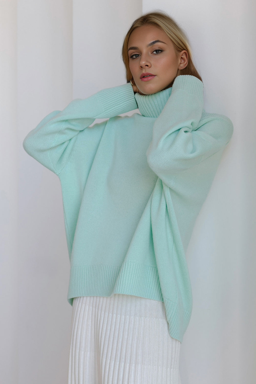 Bella BLA turtleneck dropped shoulder long sleeve sweater featuring a cozy knit fabric and relaxed fit, perfect for casual wear.