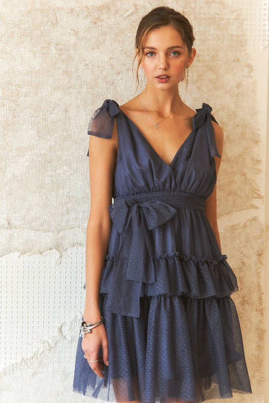 BELLA tie shoulder polka dot mesh dress featuring ruffled sleeves and a fitted waist, perfect for stylish occasions.