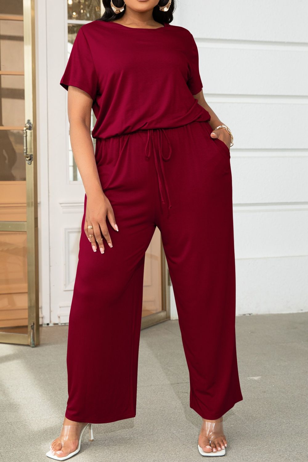 Plus size BELLA trendsi short sleeve jumpsuit with drawstring waist, casual and comfortable for everyday wear.