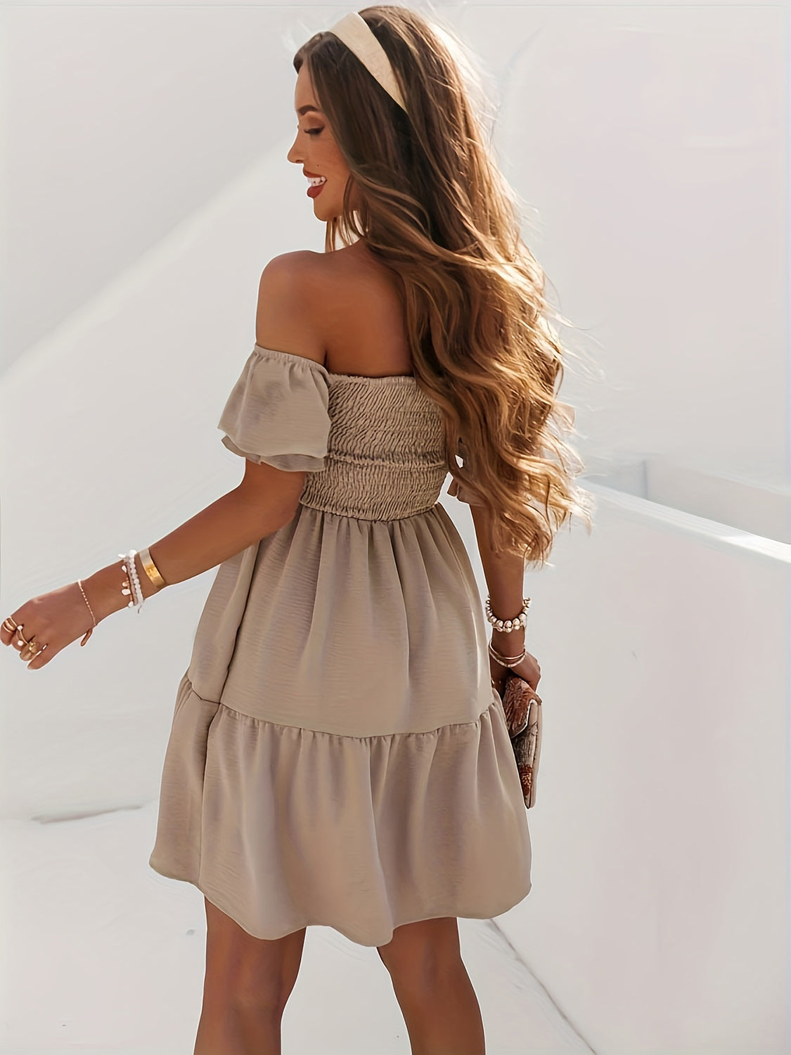 BELLA Trendsi full size ruffled off-shoulder short sleeve dress displayed on a hanger with a flowy, feminine design and ruffle details.
