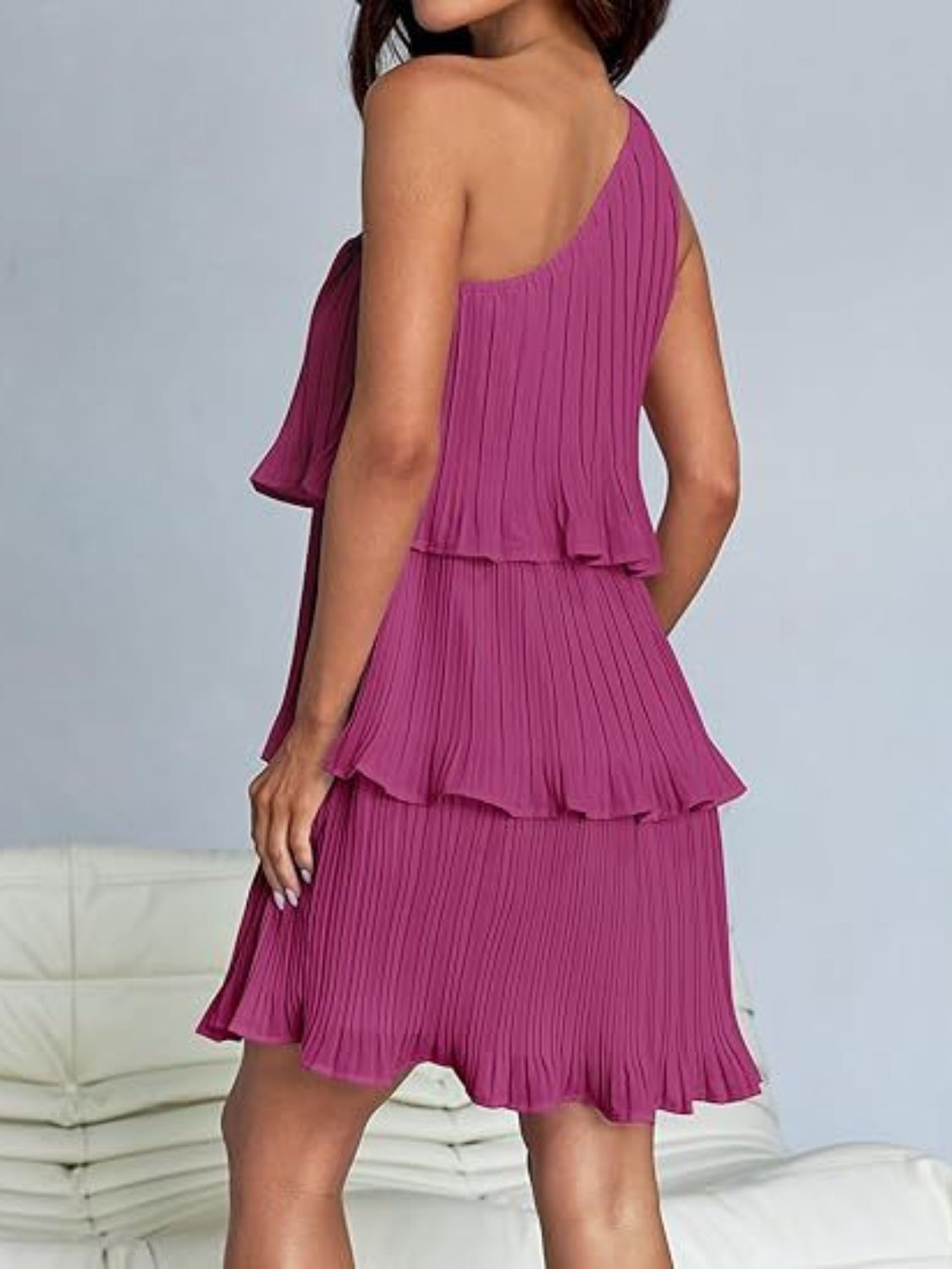 BELLA layered single shoulder mini dress from trendsi, showing a stylish, trendy design with a single shoulder strap and layered detail.