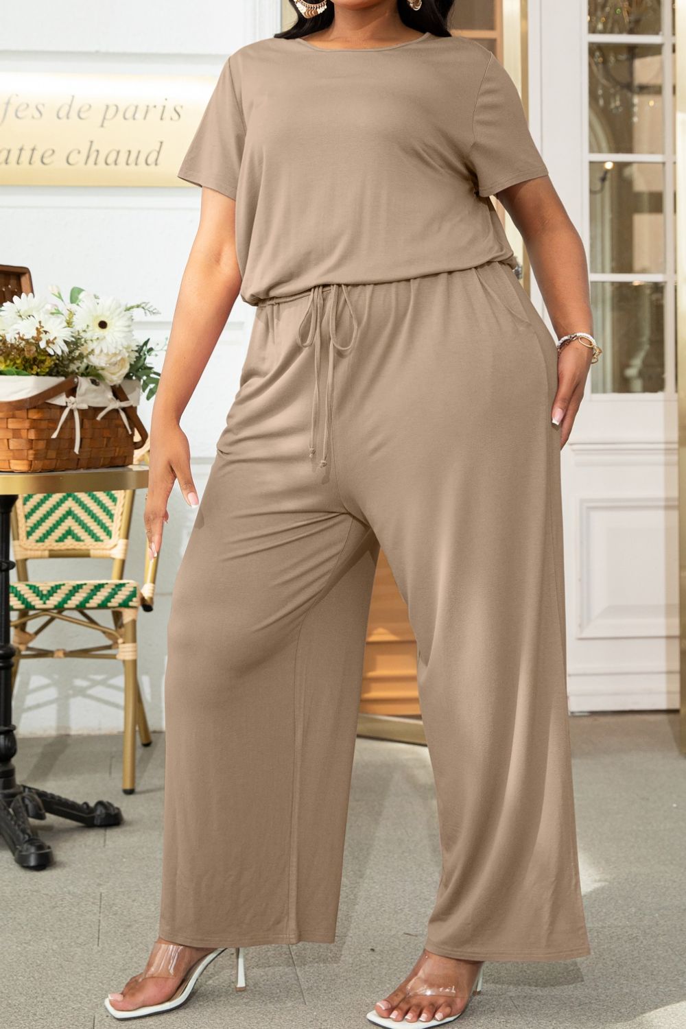 Plus size BELLA drawstring waist short sleeve jumpsuit, casual fashion with a relaxed fit, shown in a front view.