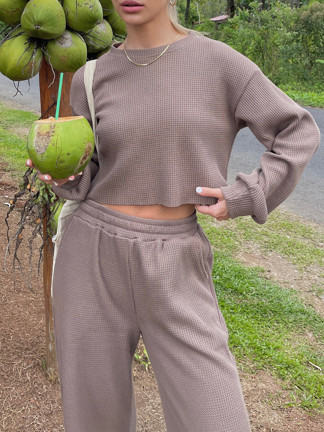 BELLA waffle-knit round neck top and pants set featuring a cozy, textured fabric in a stylish casual design.