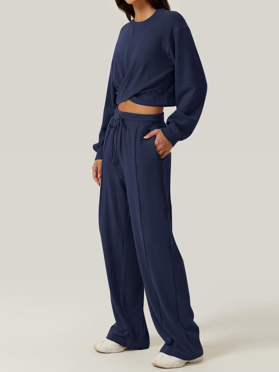 BELLA trendsi crisscross round neck top with matching drawstring pants set, featuring a stylish and comfortable casual outfit.