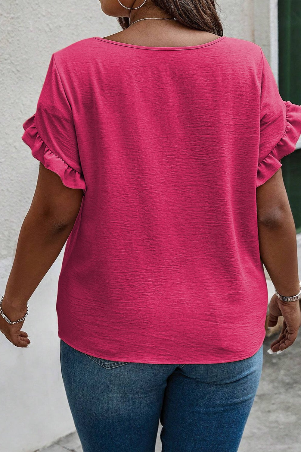 Plus size BELLA ruffled round neck short sleeve blouse with feminine ruffle details, soft fabric, and relaxed fit.
