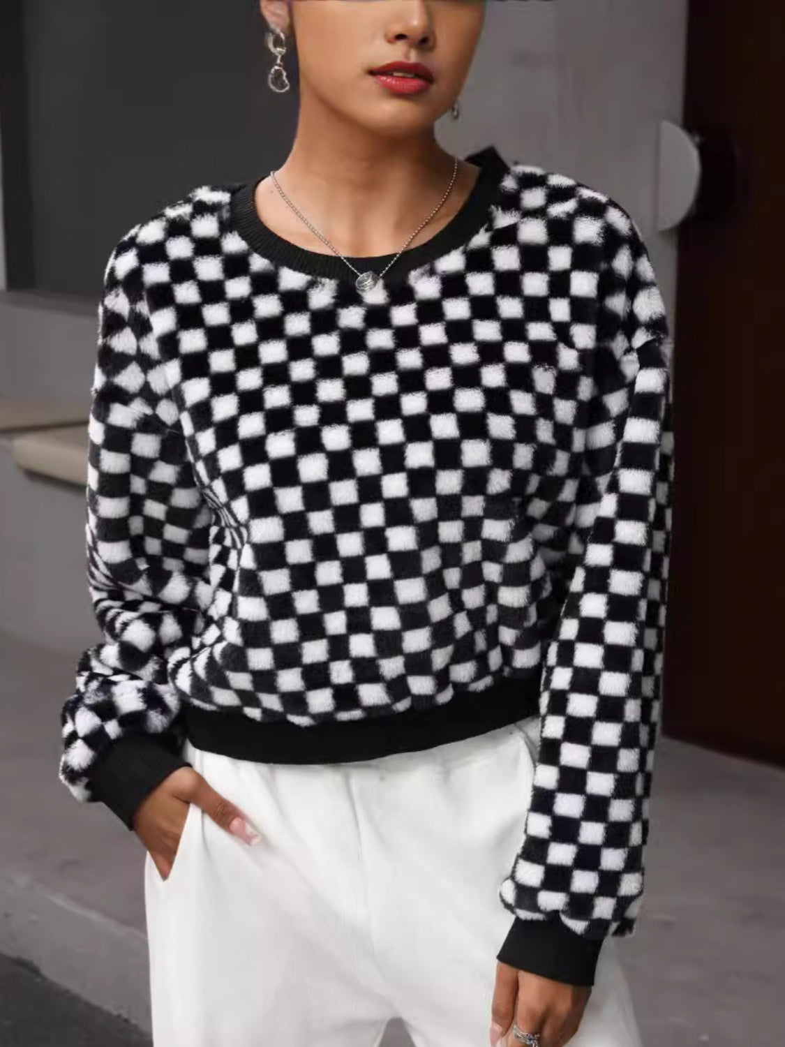 BELLA plaid round neck long sleeve sweater featuring a classic pattern and comfortable fit, ideal for casual wear.