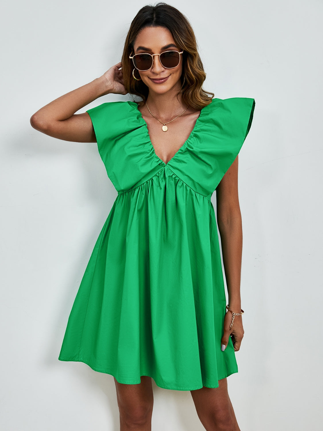 BELLA V-neck cap sleeve mini dress with a fitted silhouette, perfect for casual or semi-formal occasions.