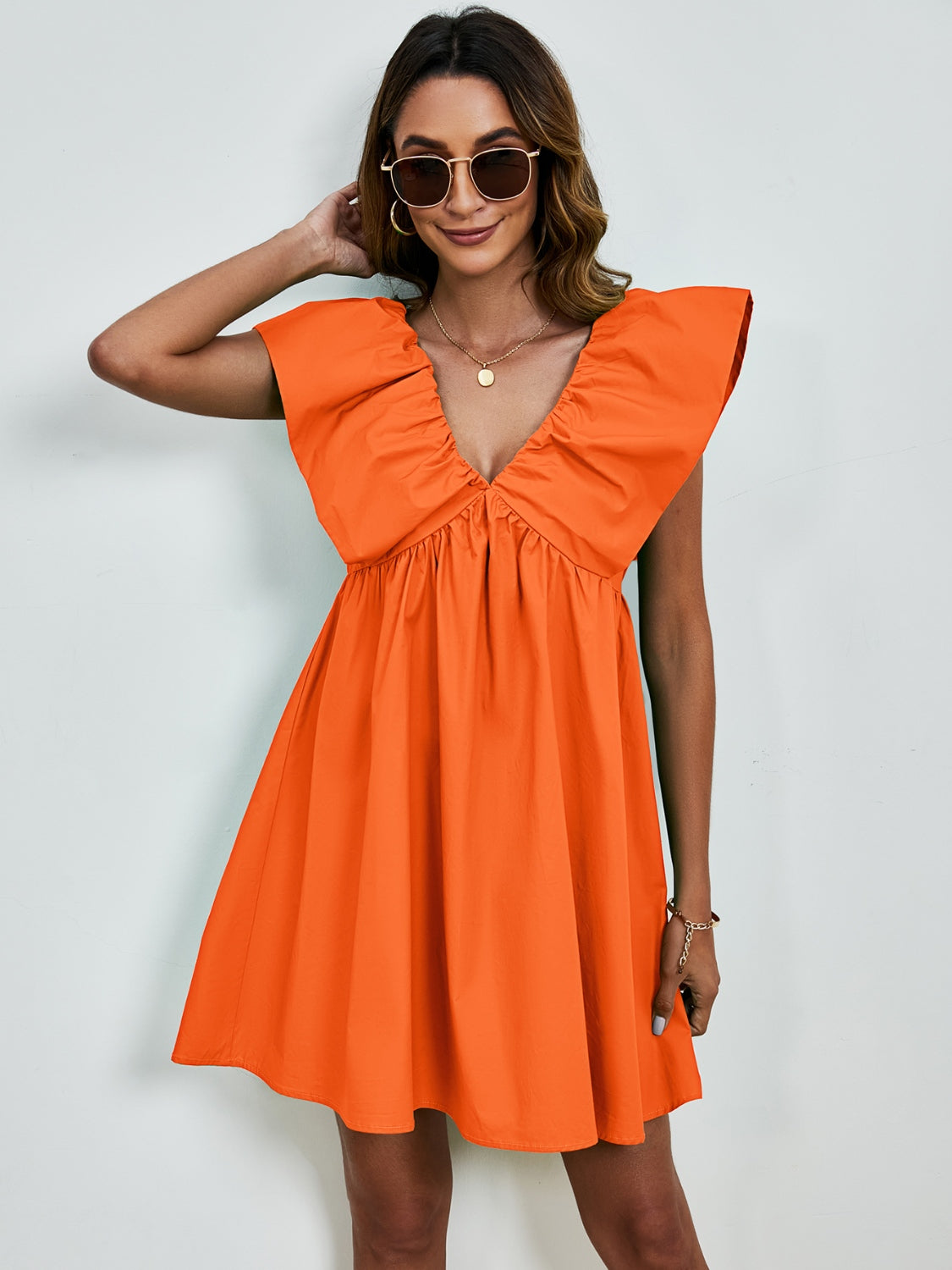 BELLA V-neck cap sleeve mini dress from Trendsi, featuring a stylish V-neck design and fitted cap sleeves in a trendy mini length
