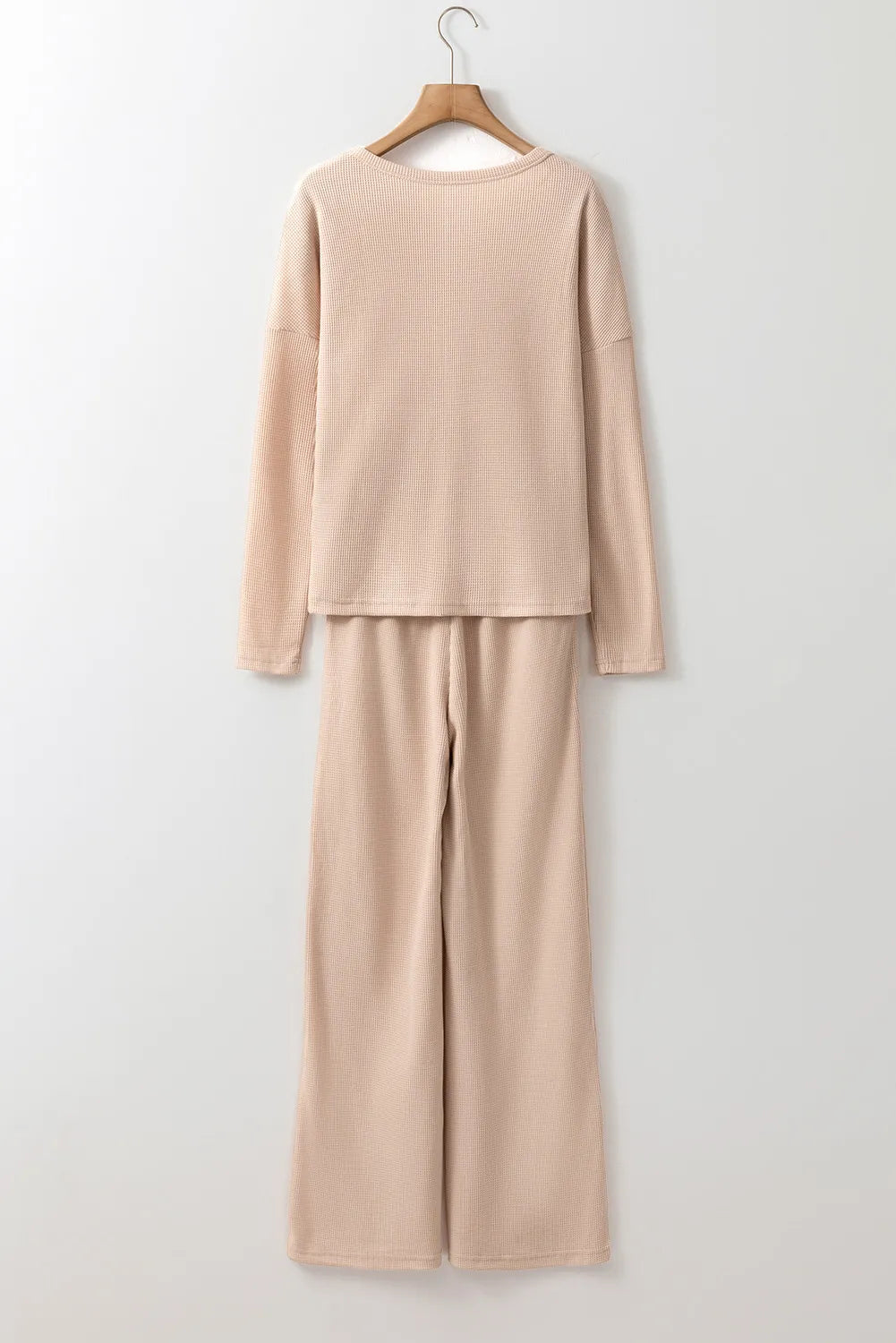 Bella Bla lounge set featuring a stylish top and drawstring pants from Trendsi, displayed in a cozy, relaxed fit.