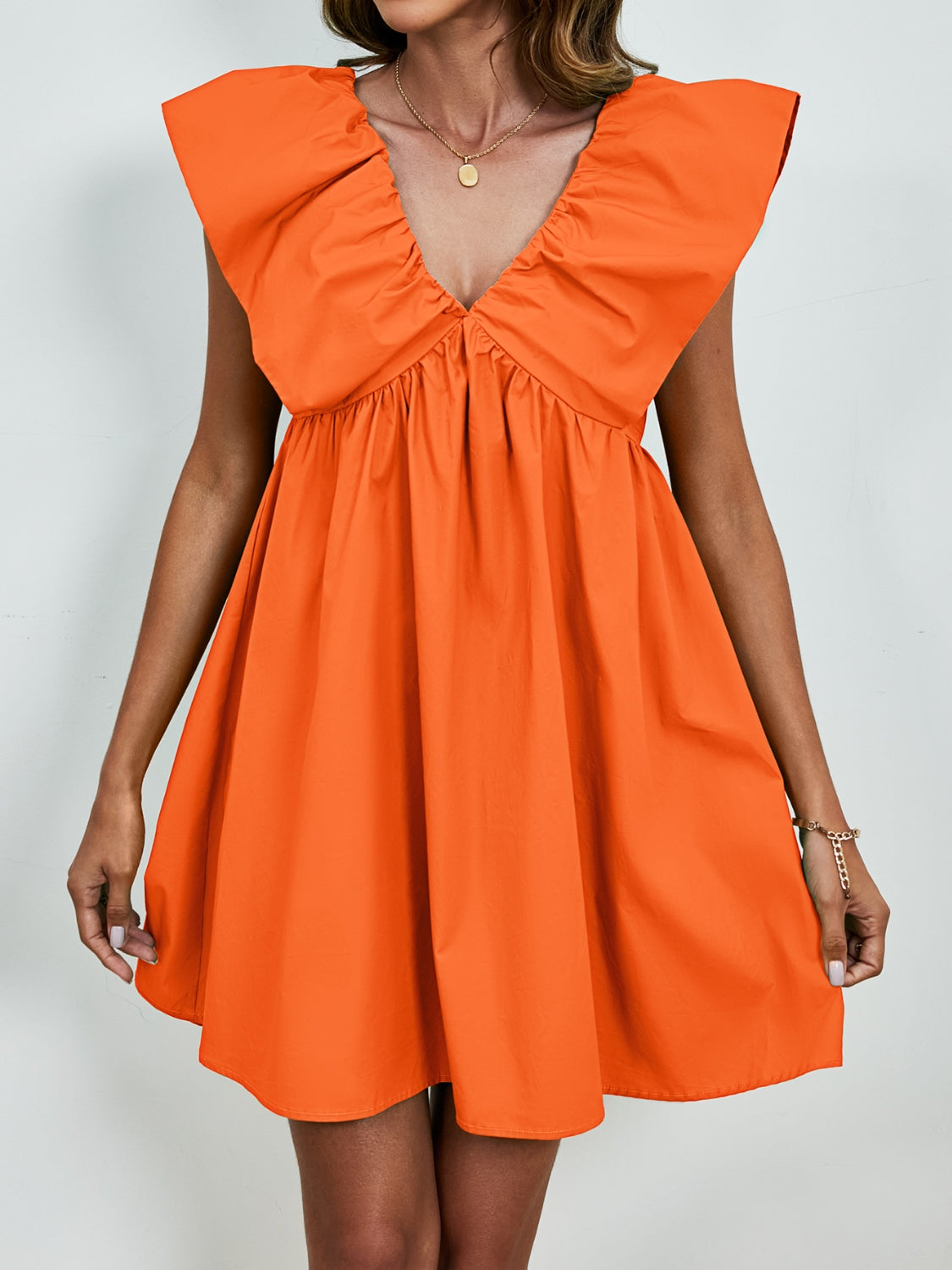 BELLA V-neck cap sleeve mini dress from Trendsi featuring a stylish and fitted design perfect for casual or dressy occasions.
