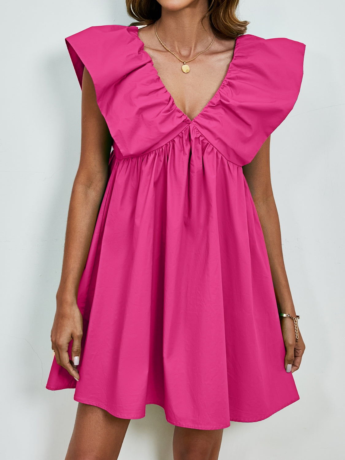 BELLA V-neck cap sleeve mini dress from Trendsi with a stylish V-neckline and fitted cap sleeves, perfect for casual or dressy occasions.