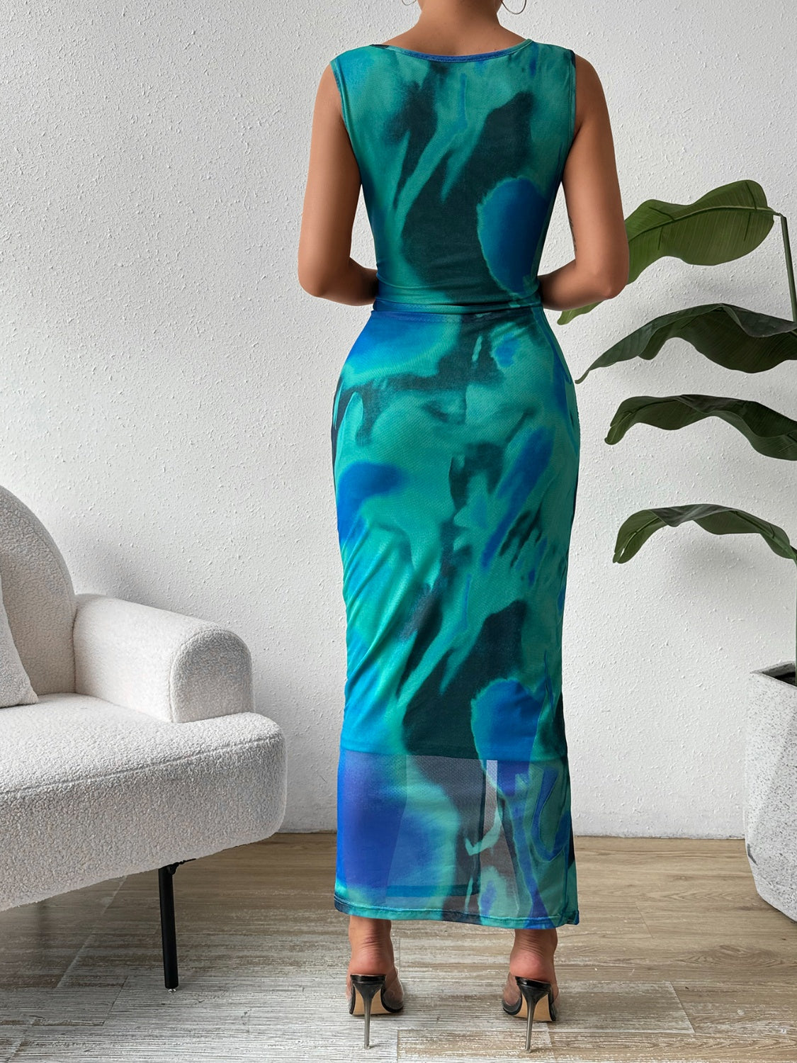 BELLA trendsi slit round neck midi tank dress worn by a model, featuring a stylish cut and sleeveless design for a casual look.