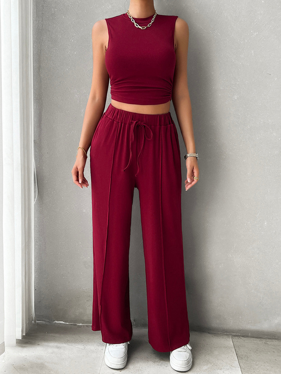 BELLA Trendsi sleeveless mock neck top with drawstring pants set, featuring a stylish, casual daytime outfit.