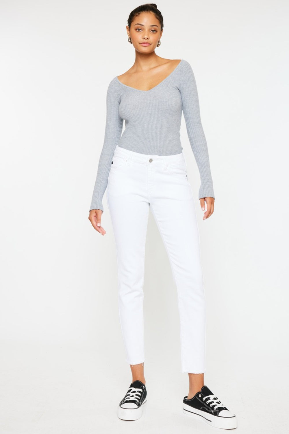 BELLA Kancan mid-rise ankle skinny jeans in denim, showing a close-up of the fit and stitching details.