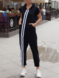 BELLA striped short sleeve hooded jumpsuit with vertical navy and white stripes, casual fit, front zip, and hood detail.
