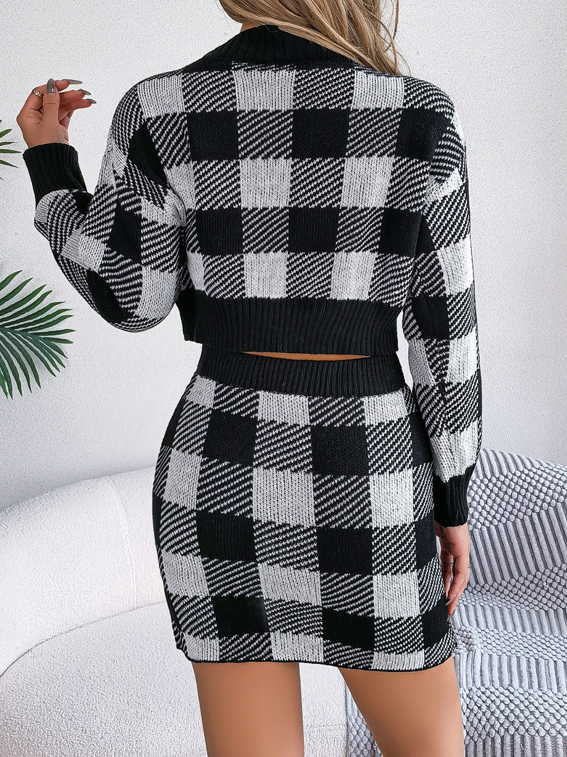 BELLA plaid round neck top and skirt sweater set featuring a classic pattern and cozy knit fabric, perfect for casual wear.