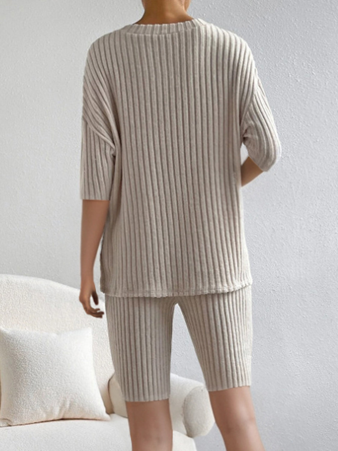 BELLA ribbed V-neck top and shorts set in matching fabric, featuring a fitted V-neck and comfortable high-waisted shorts.