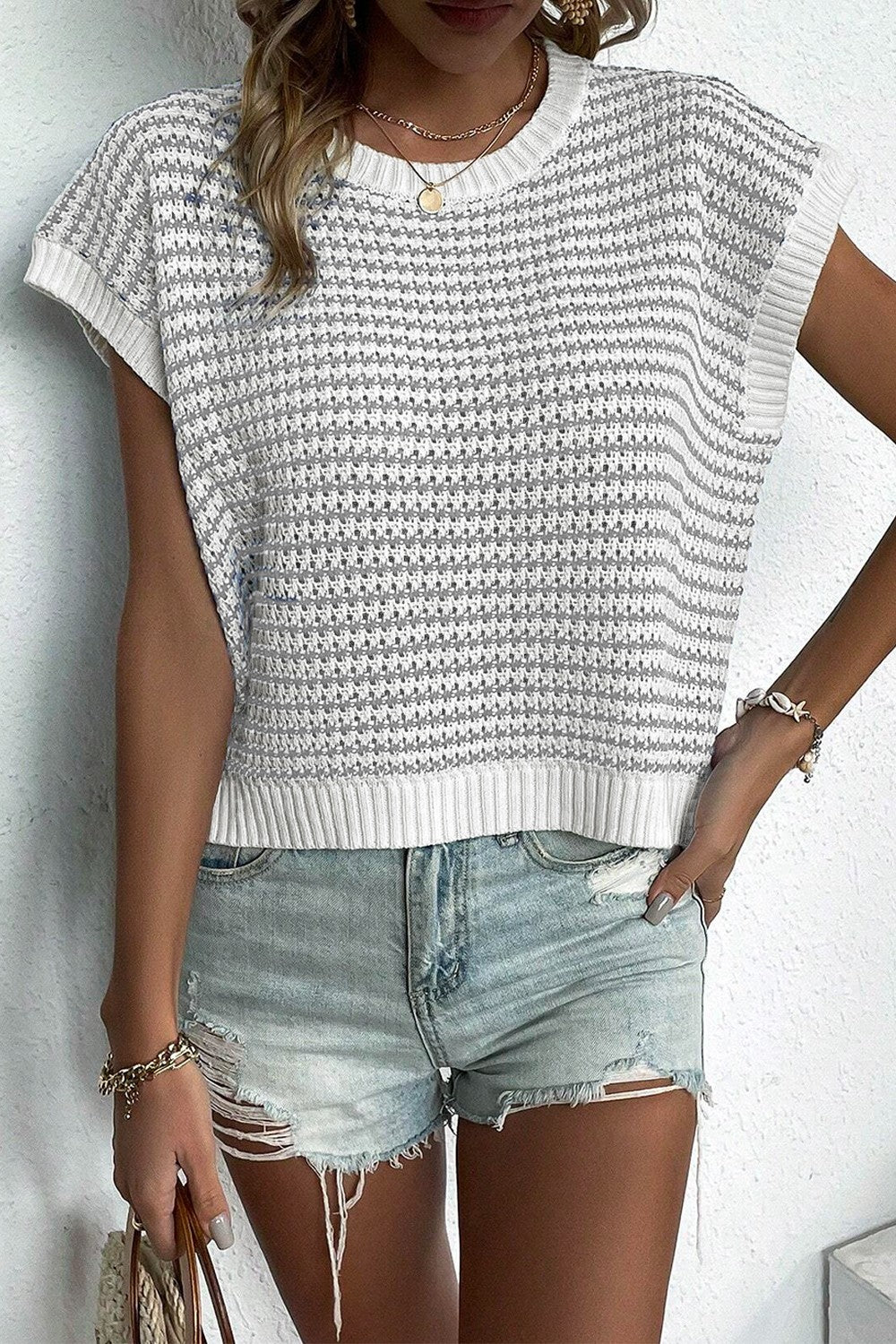 BELLA striped round neck sweater vest with colorful horizontal stripes, cozy knit fabric, and ribbed neckline.