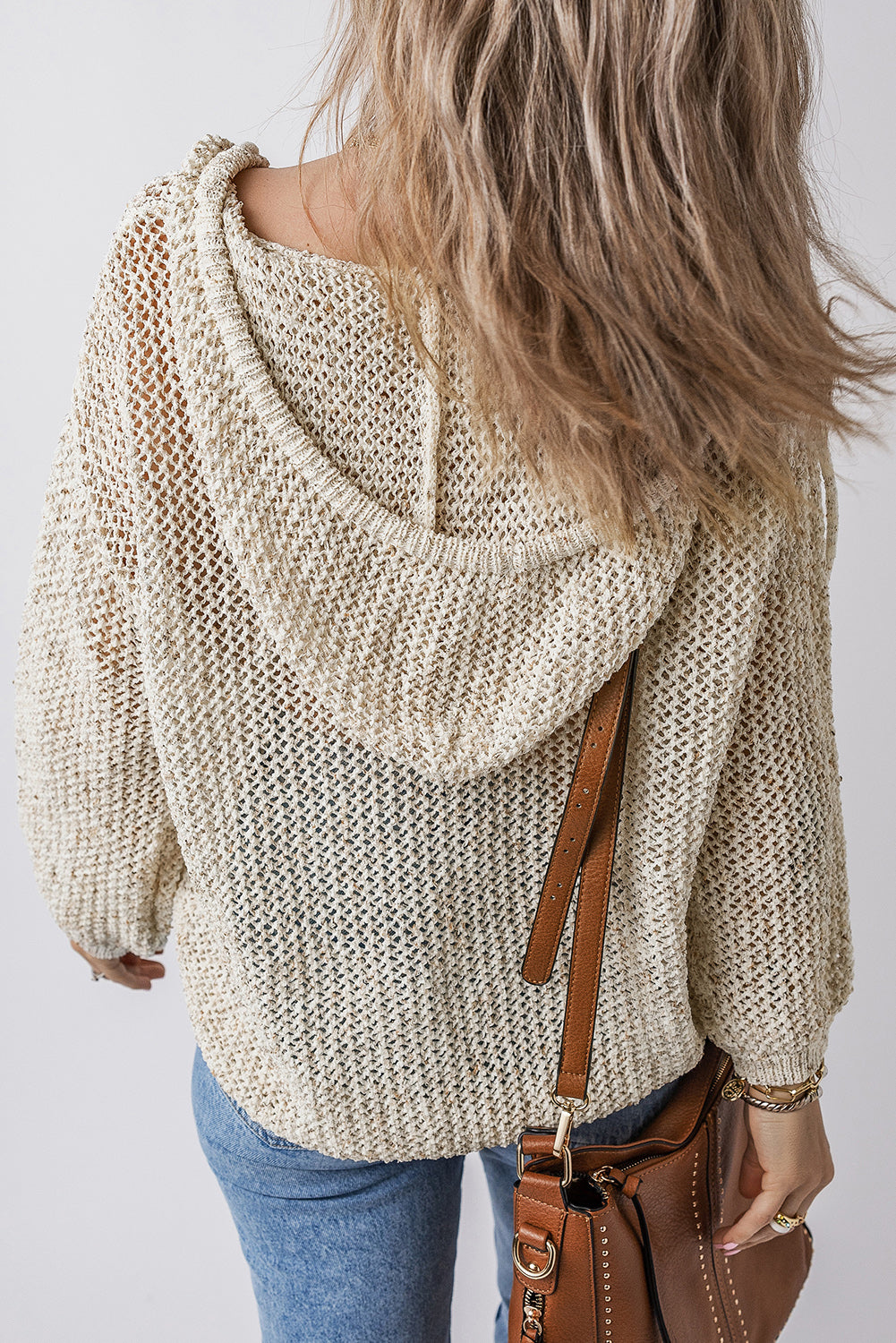 BELLA openwork dropped shoulder hooded knit top featuring a stylish, breathable design with a relaxed fit and trendy details.